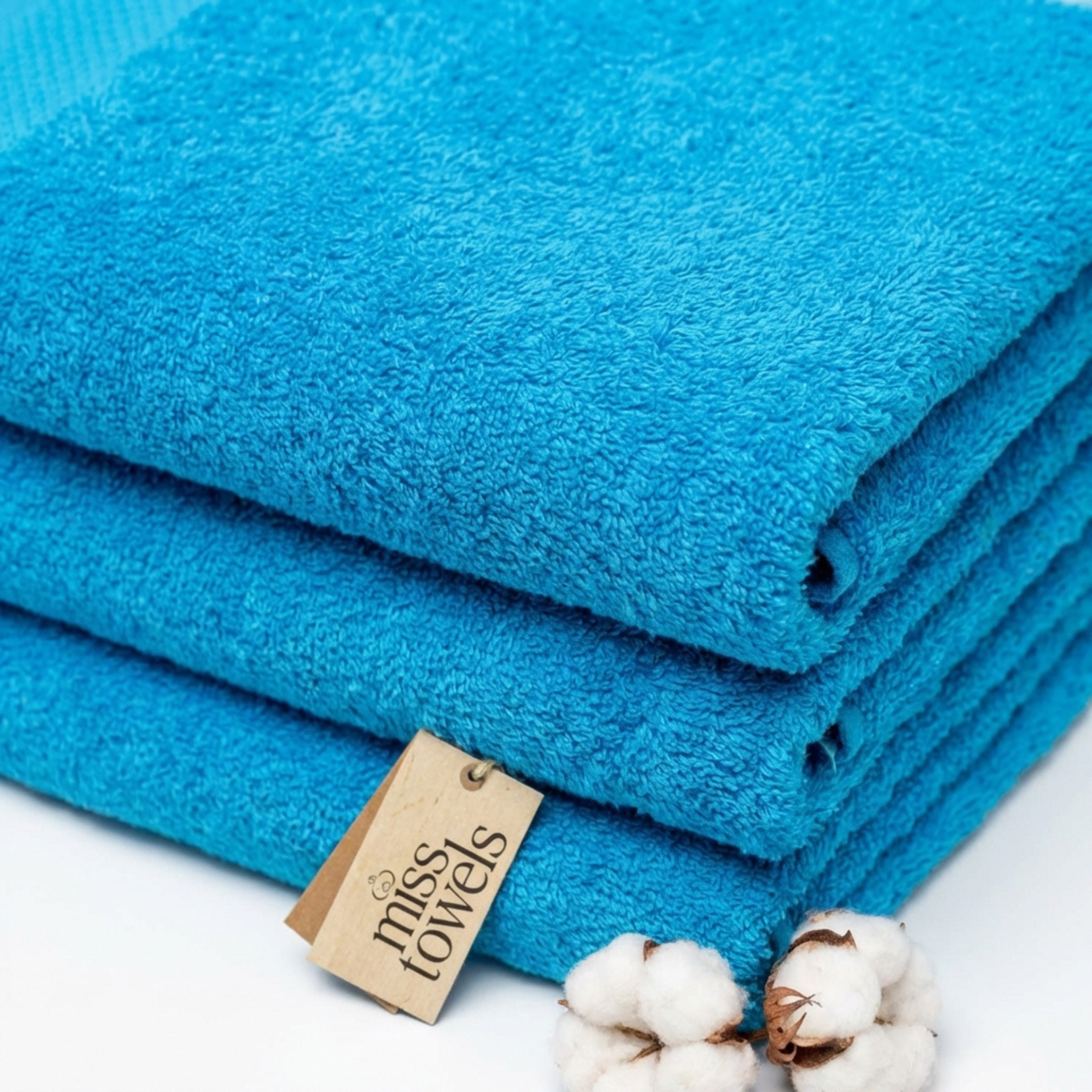 Stapel turquoise hotel handdoeken 